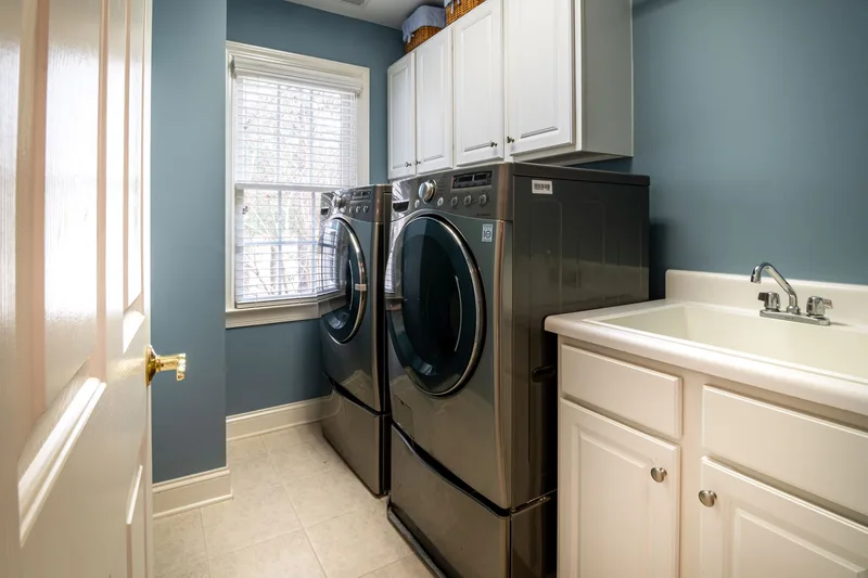 Dryer appliance in a laundry room